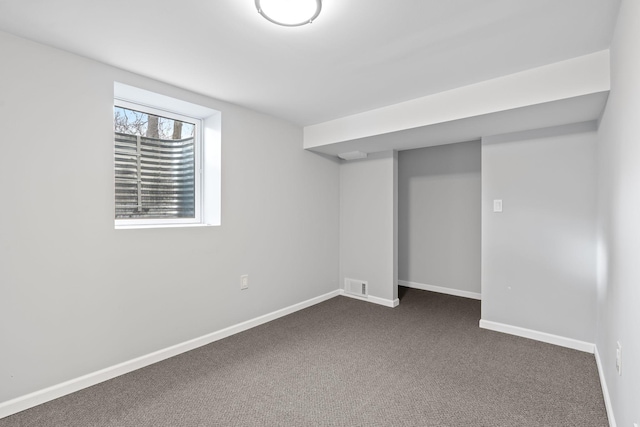 basement with dark colored carpet