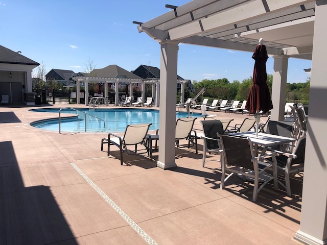 view of pool with a patio and a pergola