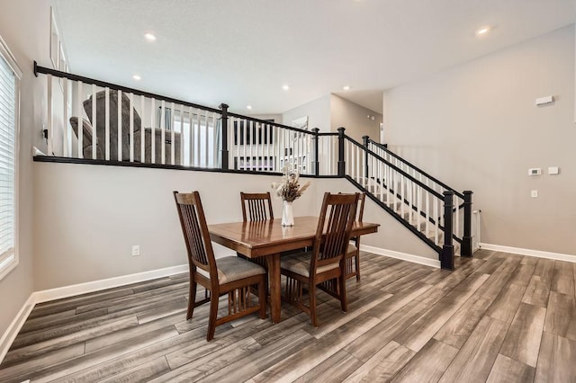 dining area with hardwood / wood-style flooring and a healthy amount of sunlight