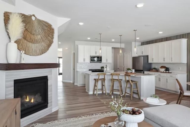 living room with dark hardwood / wood-style floors and sink