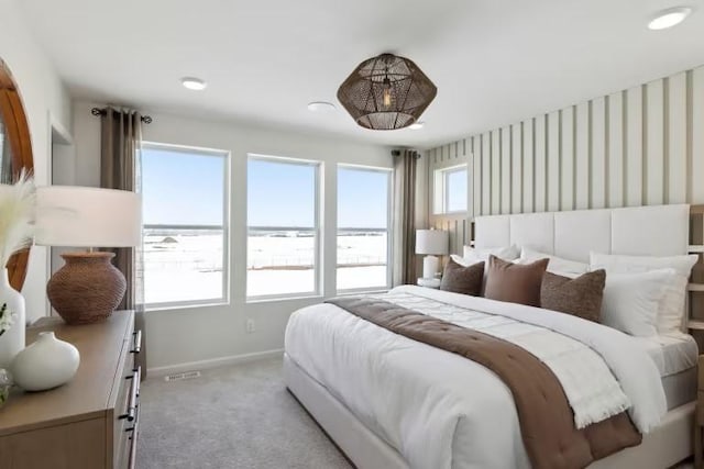 bedroom featuring light colored carpet