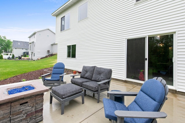 view of patio / terrace featuring an outdoor fire pit