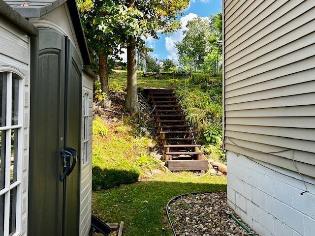 view of yard featuring stairway