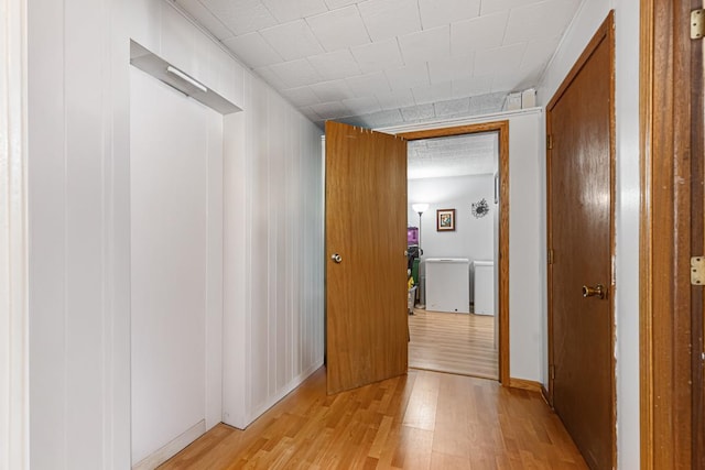 hallway with light wood-style flooring