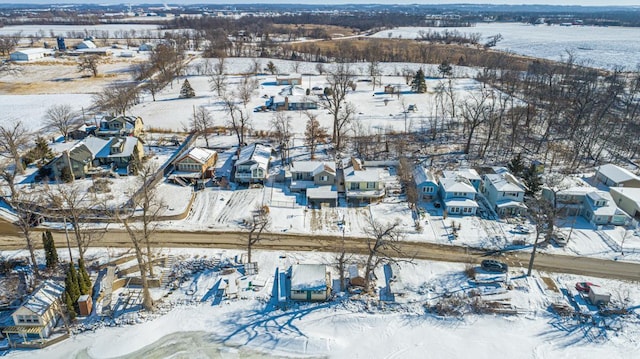 snowy aerial view with a residential view