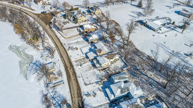 snowy aerial view featuring a residential view