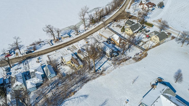 snowy aerial view with a residential view