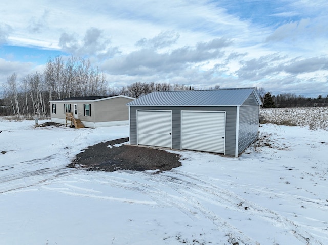 view of snow covered garage