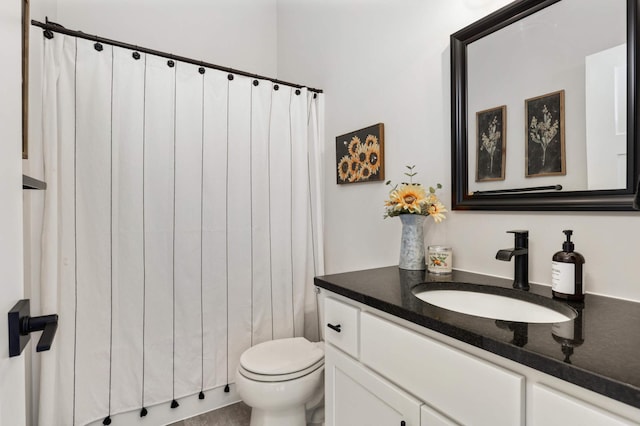 bathroom with toilet and vanity