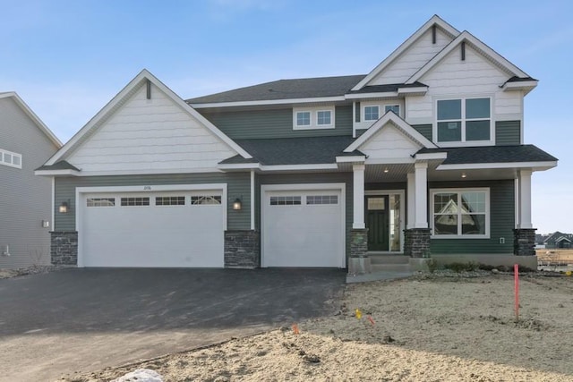 craftsman inspired home featuring a garage