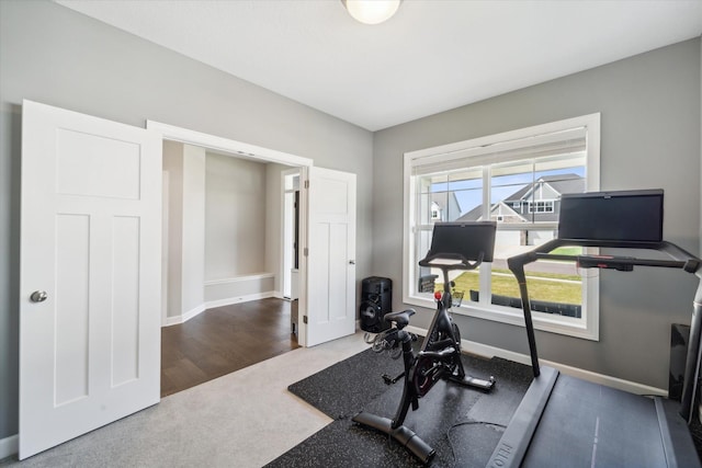 workout room with carpet and plenty of natural light