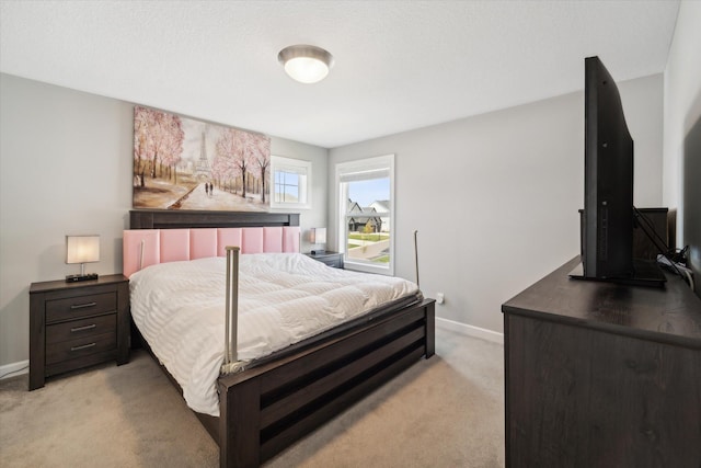 bedroom with light colored carpet