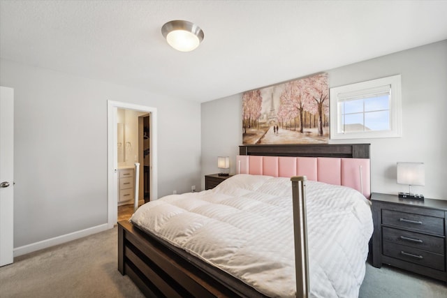 carpeted bedroom with ensuite bath