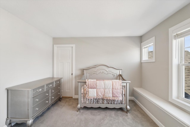 bedroom featuring light carpet