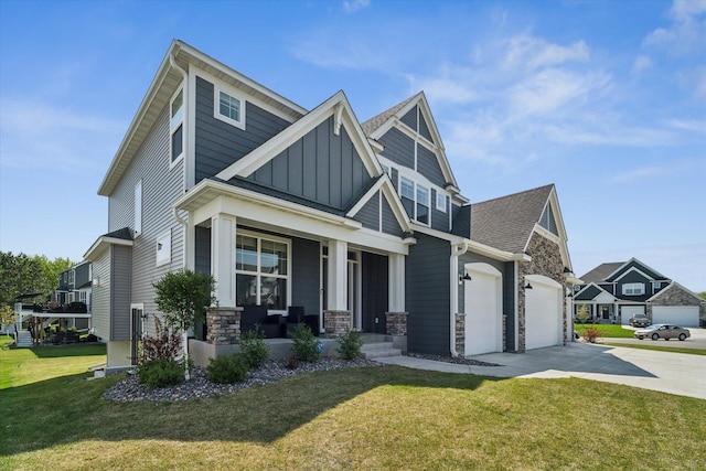 view of front of house with covered porch, a front lawn, and a garage