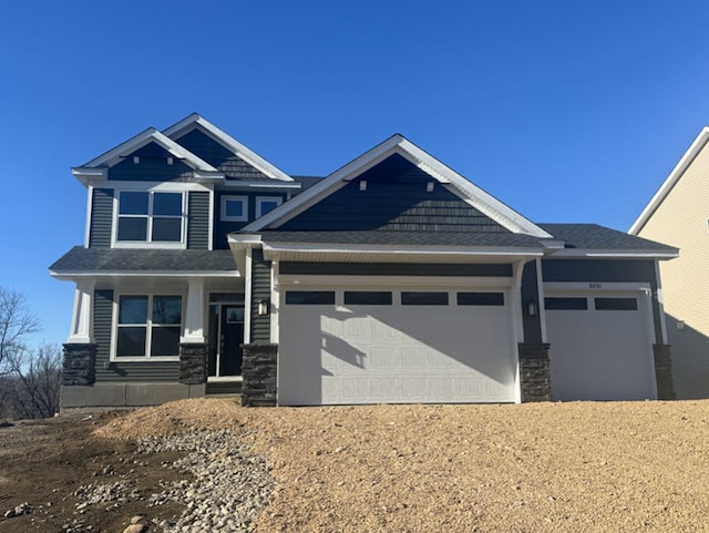 craftsman house featuring a garage