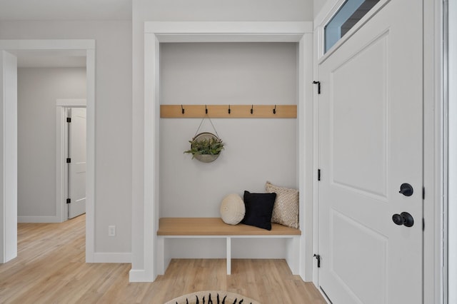 mudroom with light hardwood / wood-style floors