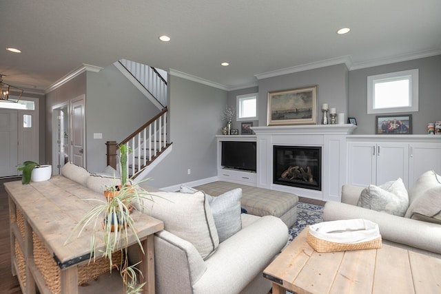 992 Southwell Enclave NE, Byron, MN 55920 - living room featuring a glass covered fireplace, crown molding, a healthy amount of sunlight, and recessed lighting