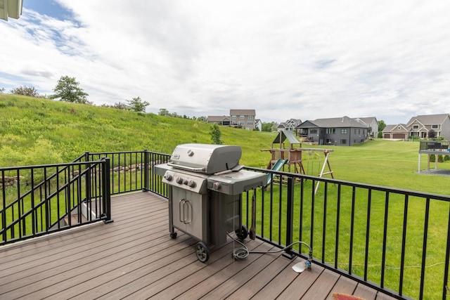 992 Southwell Enclave NE, Byron, MN 55920 - wooden terrace with a residential view, a lawn, a playground, and a grill