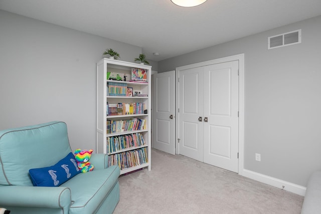 992 Southwell Enclave NE, Byron, MN 55920 - sitting room with carpet floors, visible vents, and baseboards