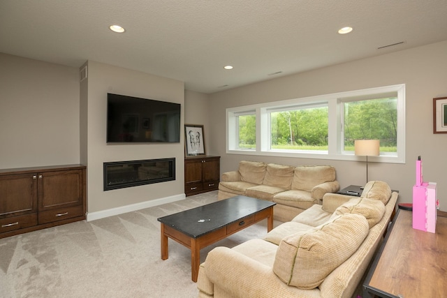 992 Southwell Enclave NE, Byron, MN 55920 - living room with baseboards, recessed lighting, and light colored carpet