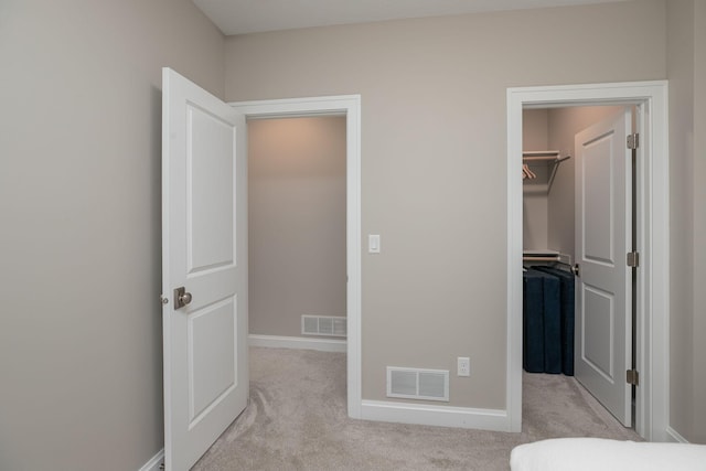992 Southwell Enclave NE, Byron, MN 55920 - unfurnished bedroom featuring a spacious closet, a closet, visible vents, and carpet