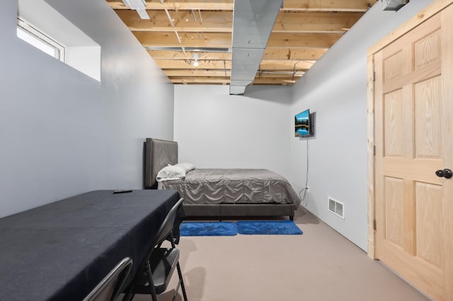 bedroom featuring concrete floors