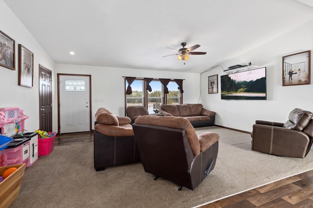 carpeted living room with vaulted ceiling and ceiling fan