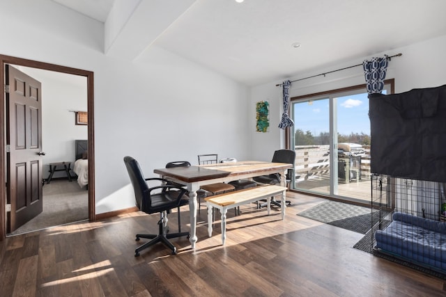 dining area with hardwood / wood-style flooring and lofted ceiling