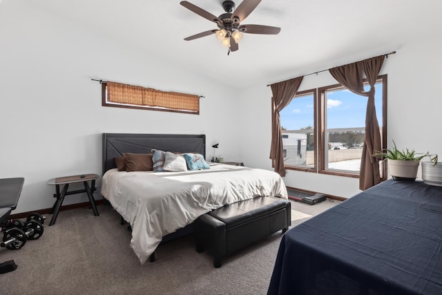 bedroom with vaulted ceiling, carpet floors, and ceiling fan