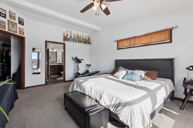 carpeted bedroom with ceiling fan, ensuite bathroom, and a closet