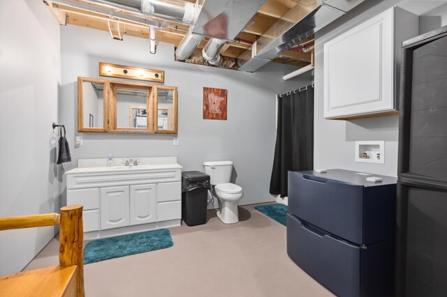 15743 County Road 31, Menahga, MN 56464 - full bath with toilet, vanity, finished concrete floors, and curtained shower