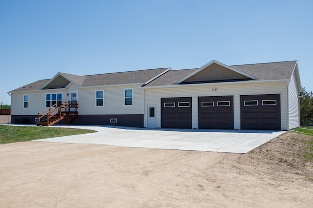 15743 County Road 31, Menahga, MN 56464 - view of front of house featuring driveway, an attached garage, and a shingled roof