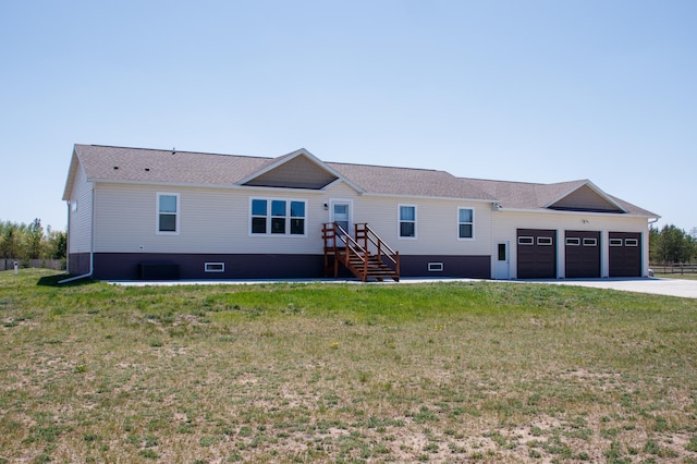 15743 County Road 31, Menahga, MN 56464 - view of front of home with an attached garage, driveway, a front lawn, and roof with shingles