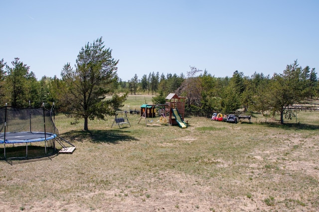 15743 County Road 31, Menahga, MN 56464 - view of grassy yard with a trampoline and a playground