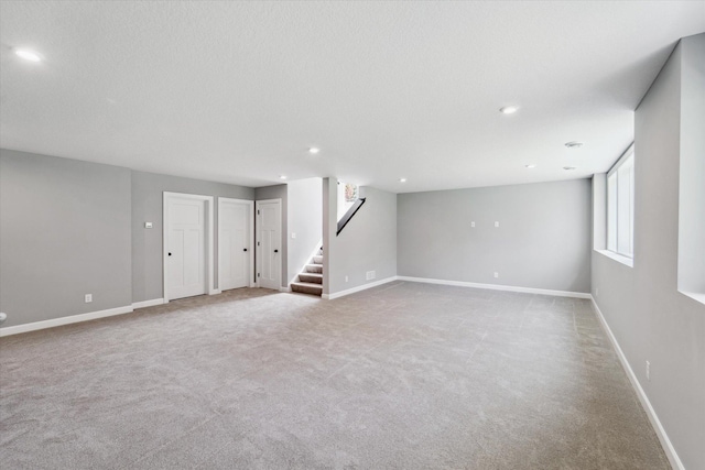 basement with light colored carpet