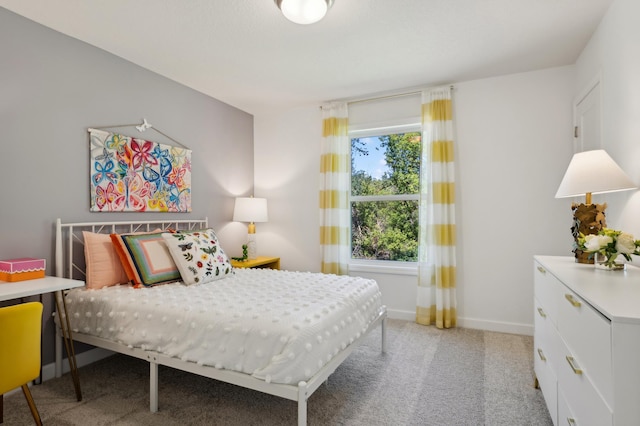 carpeted bedroom with multiple windows