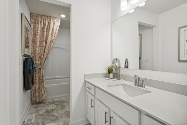 bathroom featuring vanity and shower / tub combo with curtain