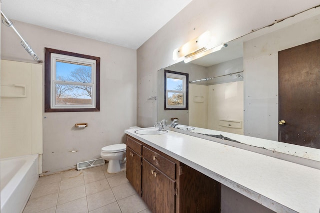 full bathroom featuring vanity, tile patterned floors, toilet, and shower / bath combination