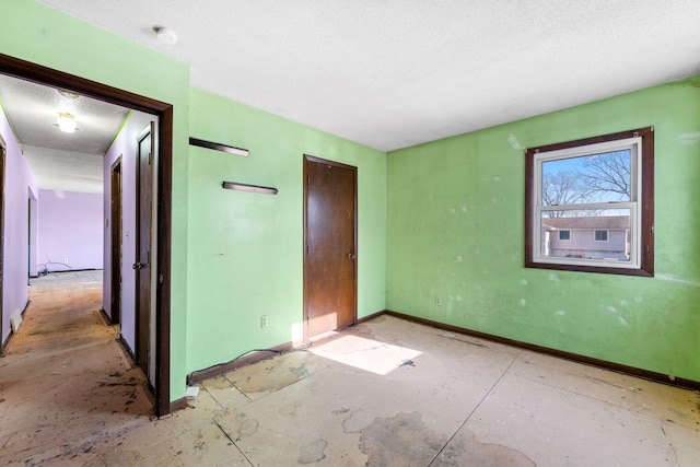 unfurnished bedroom with a closet and a textured ceiling