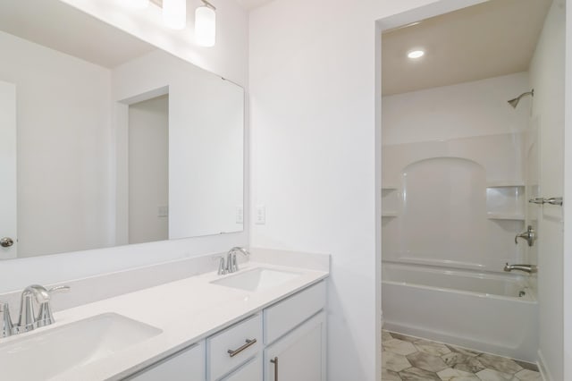 bathroom featuring bathtub / shower combination and vanity