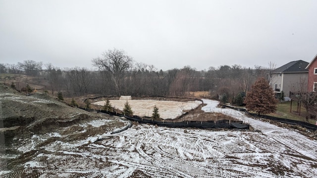 view of yard layered in snow