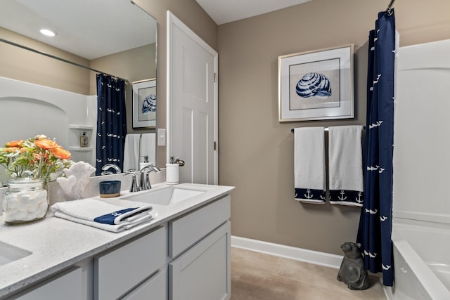 bathroom with vanity and shower / tub combo