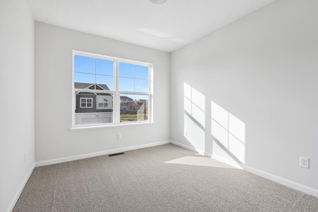 spare room with carpet floors