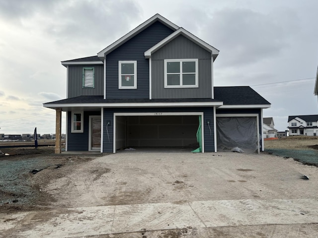 view of front of property with a garage