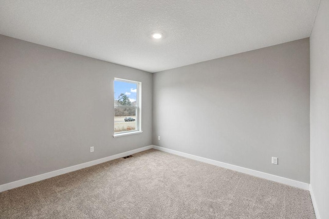 13621 Aulden Ave, Rosemount, MN 55068 - spare room featuring light carpet, baseboards, recessed lighting, and a textured ceiling