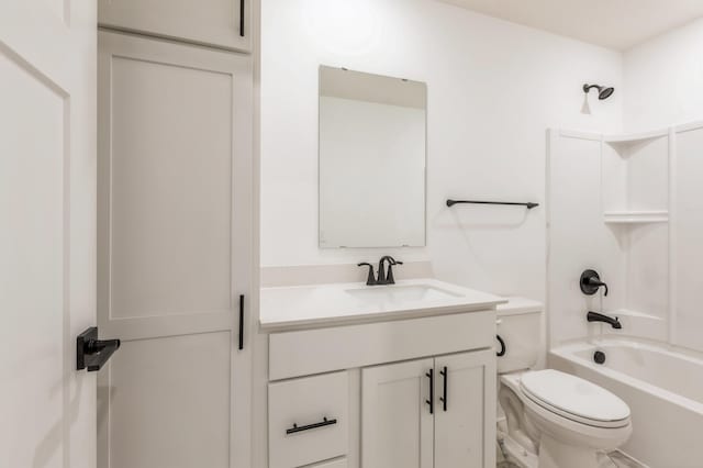 full bathroom with washtub / shower combination, vanity, and toilet