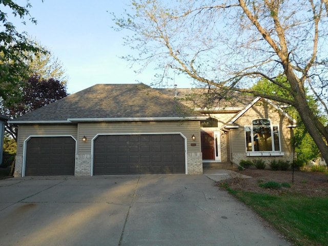 6462 Kingfisher Ct, Lino Lakes, MN 55014 - view of front of property with brick siding, a garage, and driveway