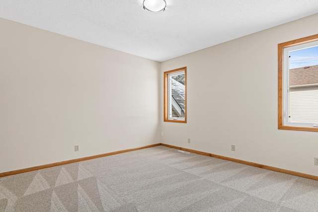 6462 Kingfisher Ct, Lino Lakes, MN 55014 - unfurnished room featuring light carpet and baseboards