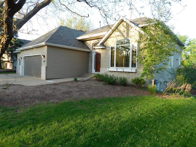 6462 Kingfisher Ct, Lino Lakes, MN 55014 - view of front facade with an attached garage, concrete driveway, a front lawn, and brick siding